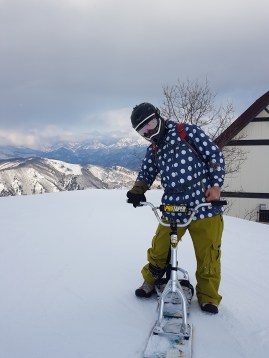 Fashionable Man with Snowbike